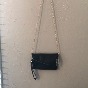 small black purse with removable gold strap